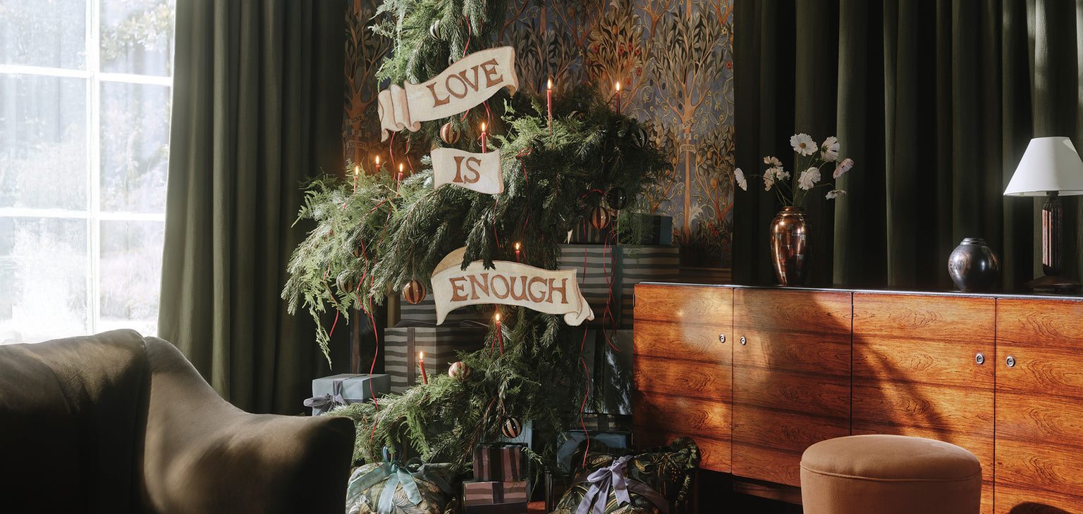 a christmas tree with presents and signs