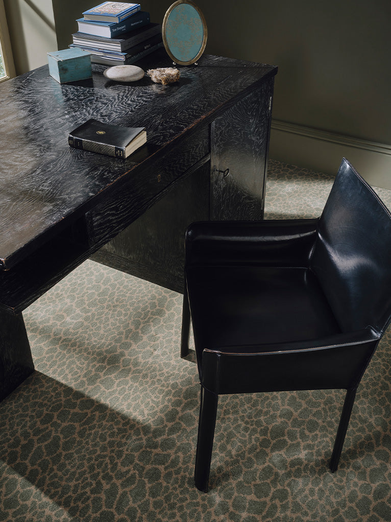 a chair next to a desk
