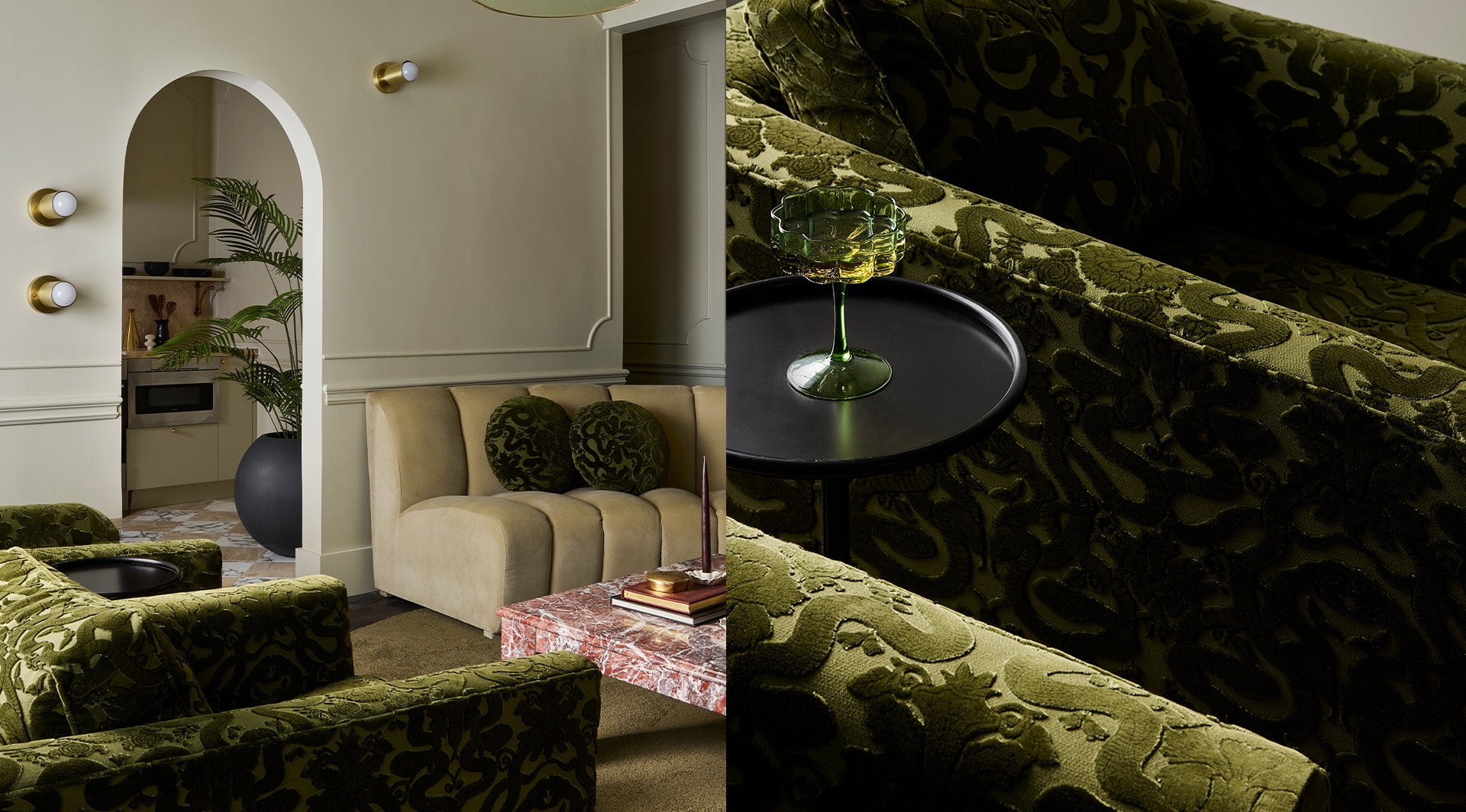 a green couches and a glass of wine