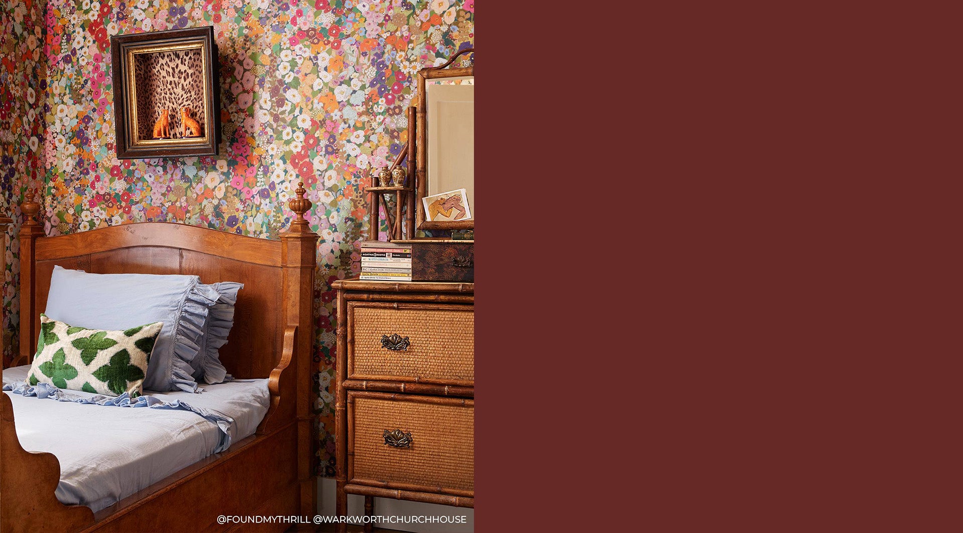 a bedroom with a floral wallpaper