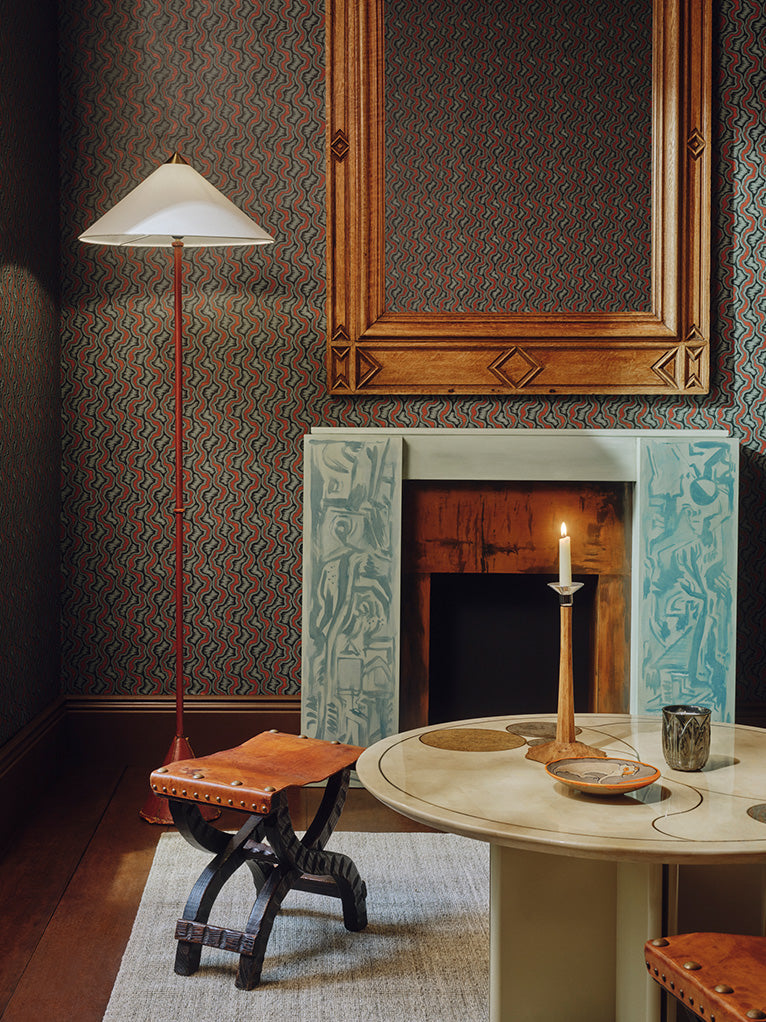 a room with a fireplace and a table