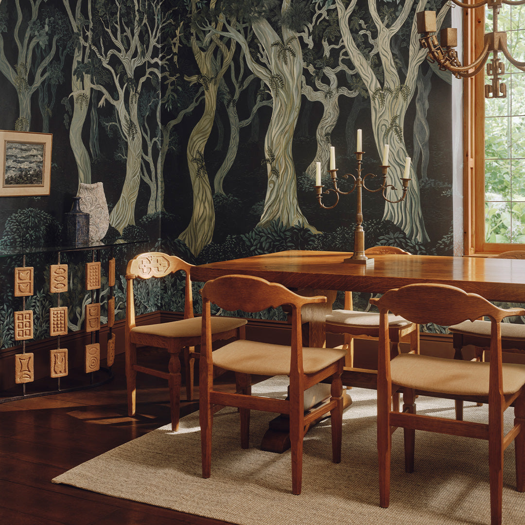 a dining room with a table and chairs
