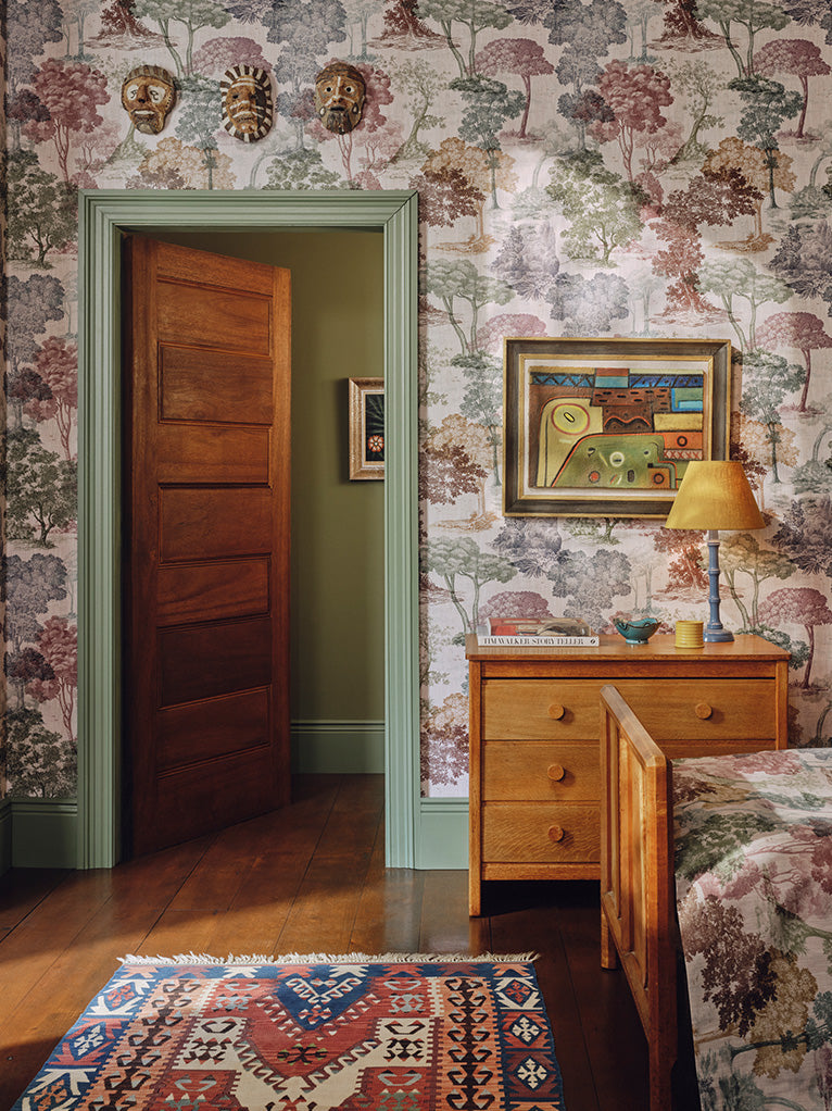 a bedroom with a door open