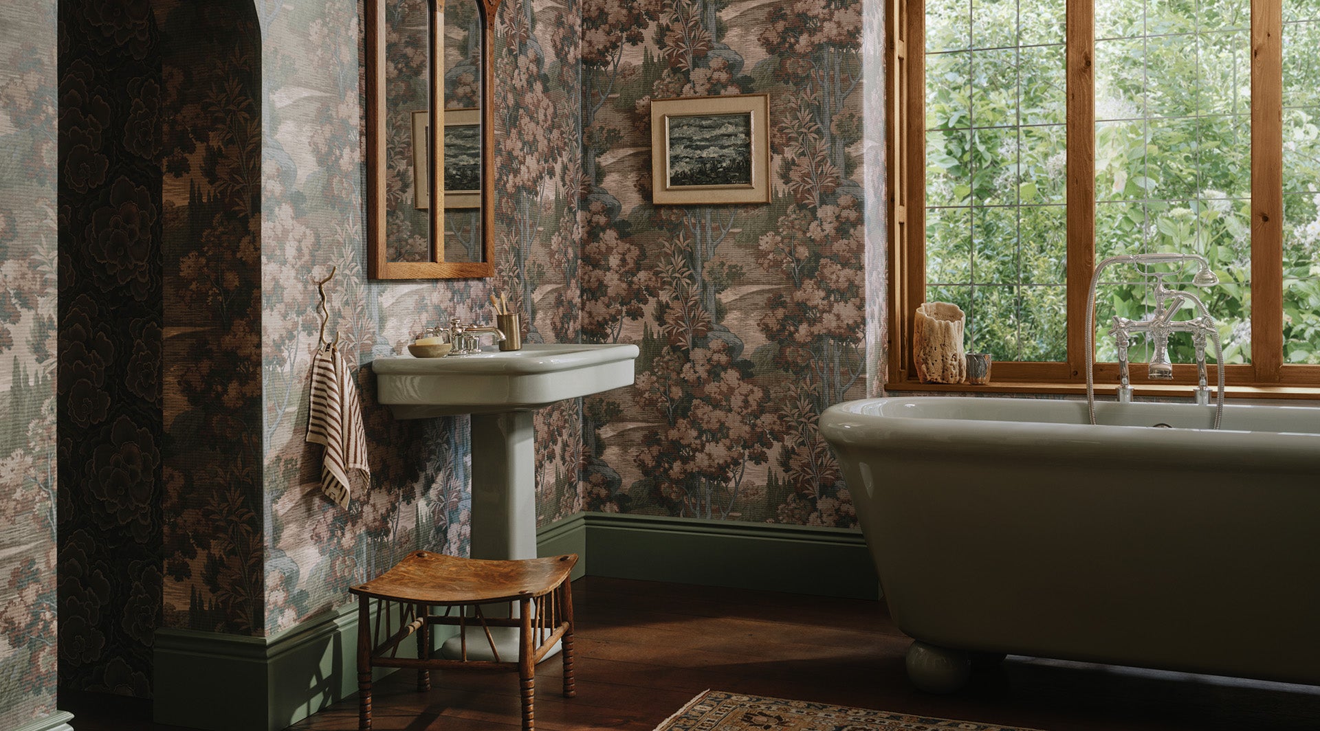 a bathroom with floral wallpaper and sink