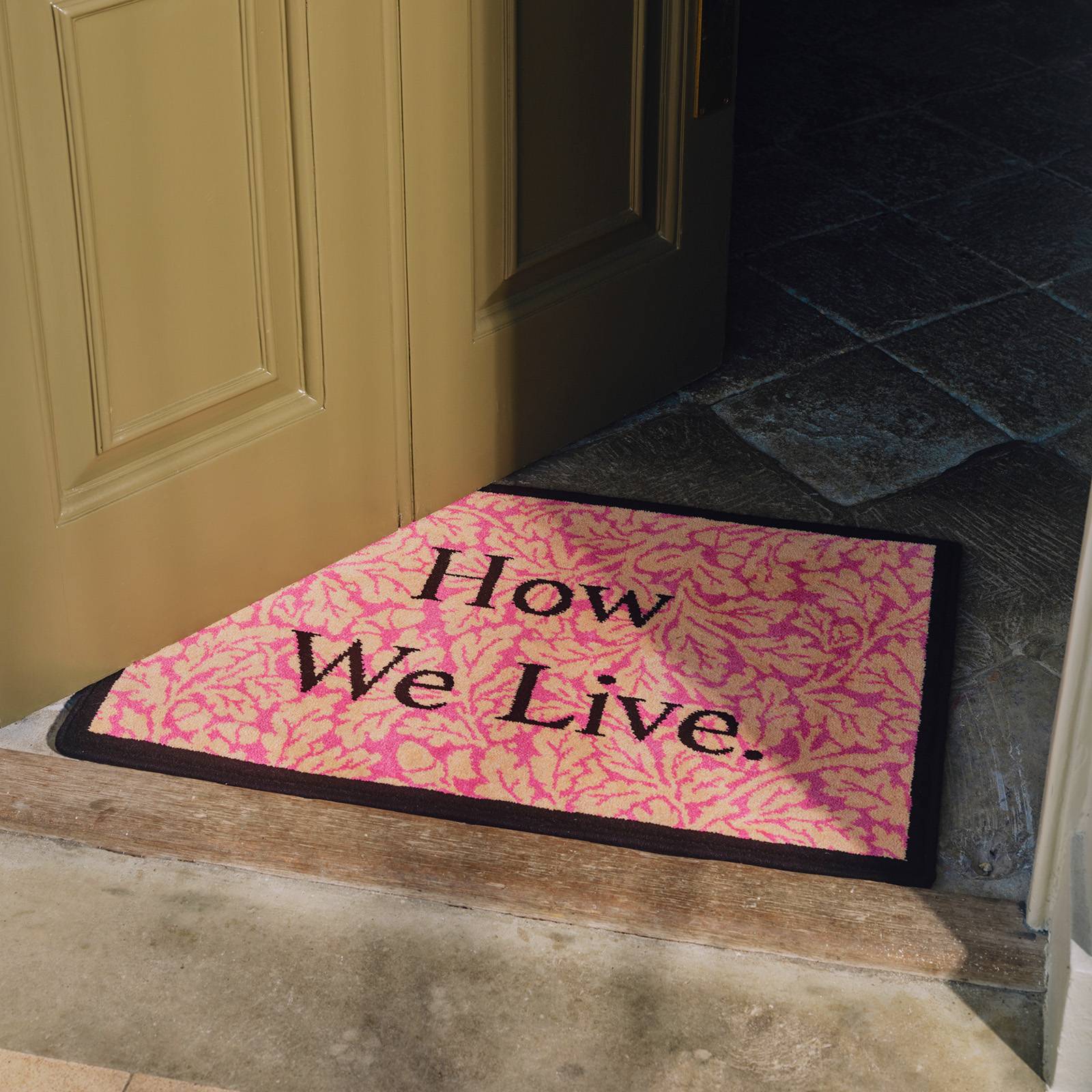 HOW WE LIVE Jeremy Deller Doormat - Coral