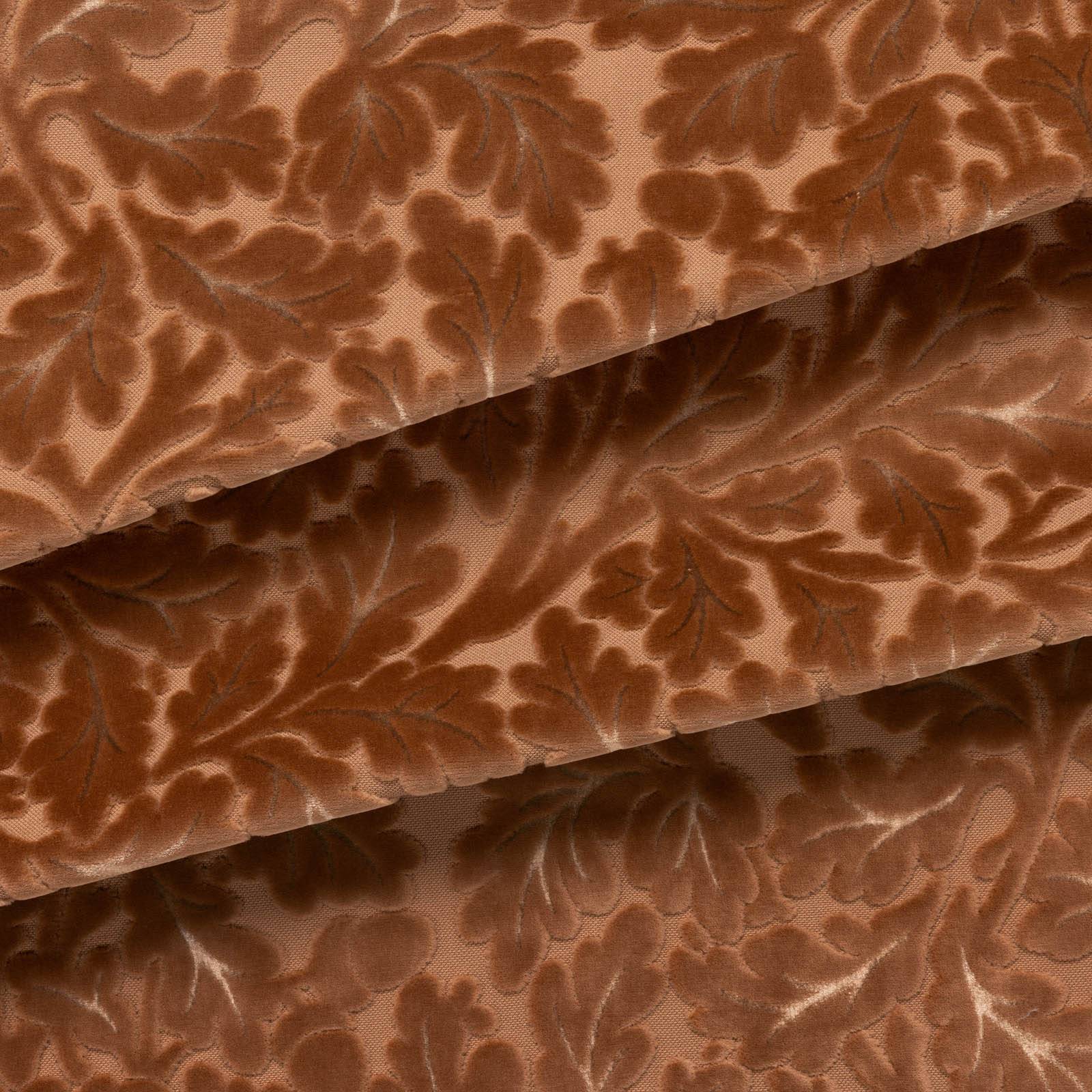 a brown fabric with leaves on it