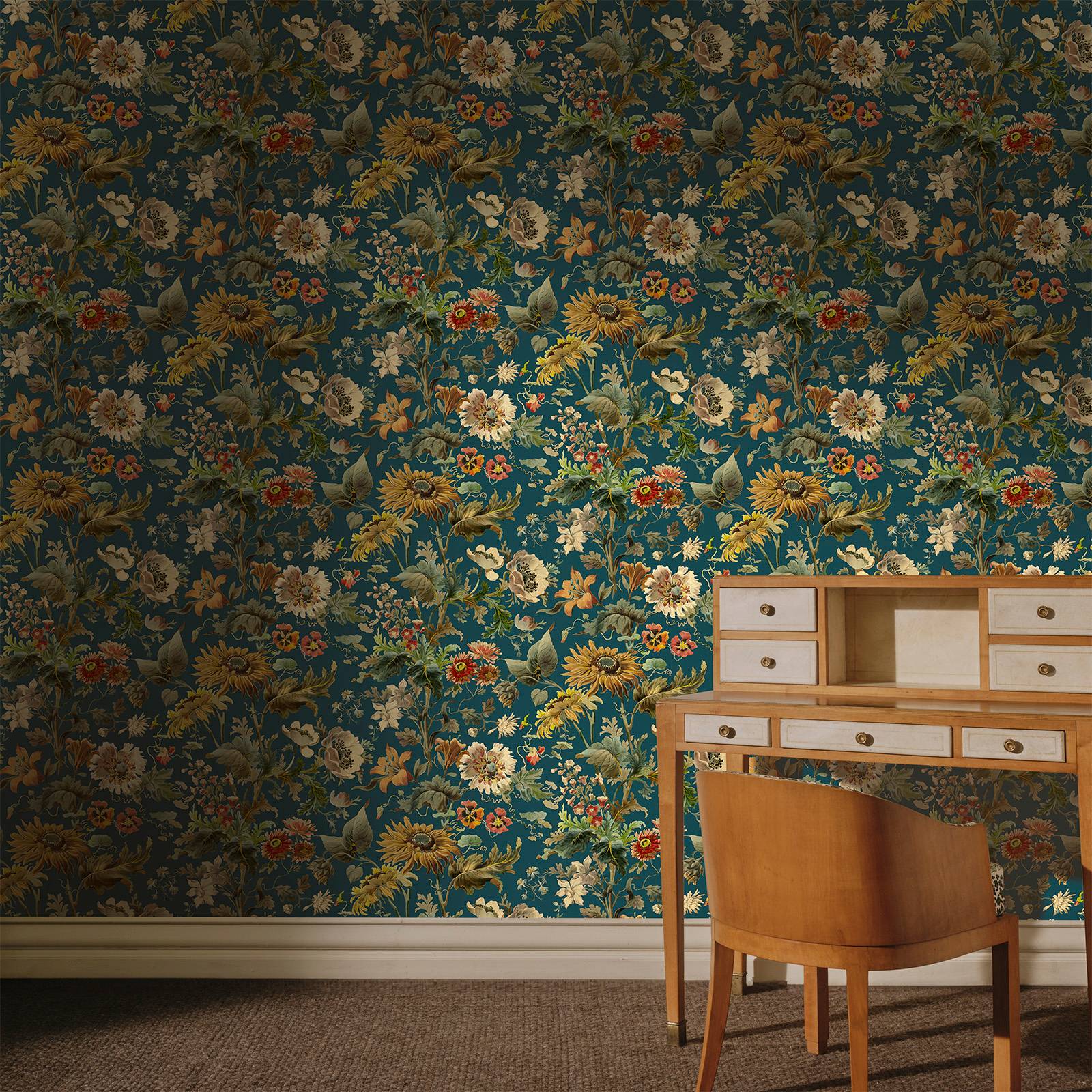 a desk and chair in front of a floral wallpaper