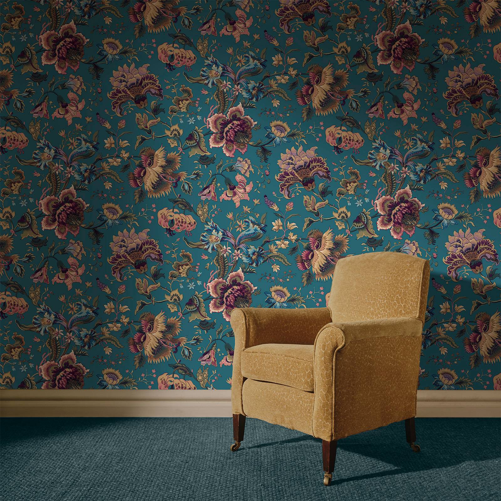 a chair in a room with floral wallpaper