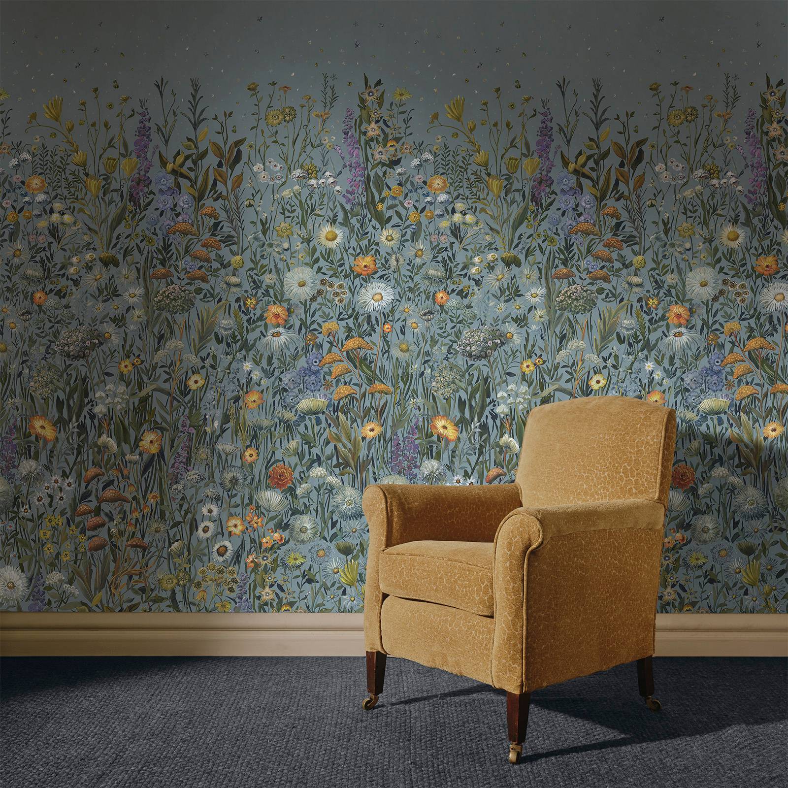 a chair in a room with a floral wallpaper