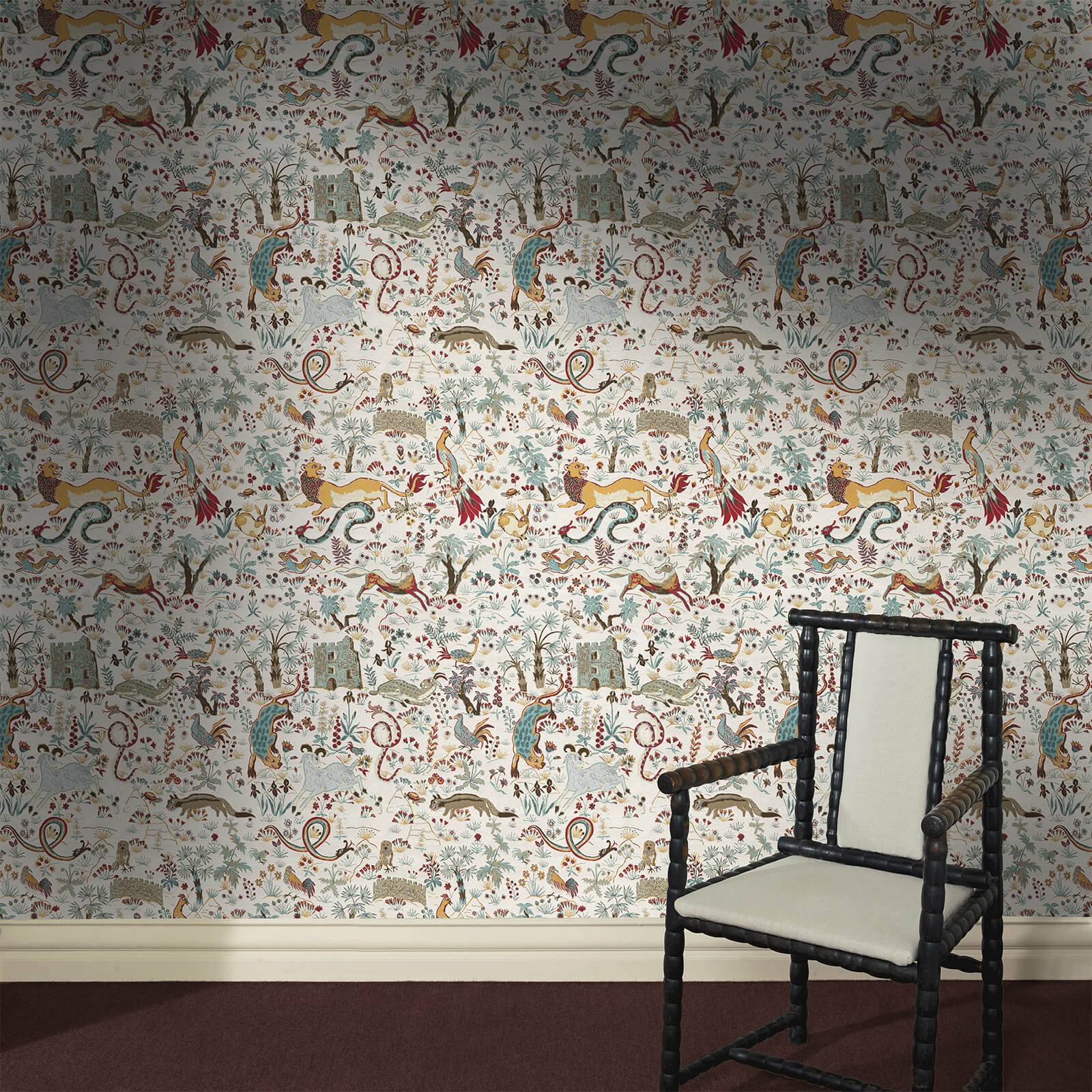 a chair in a room with a wallpaper