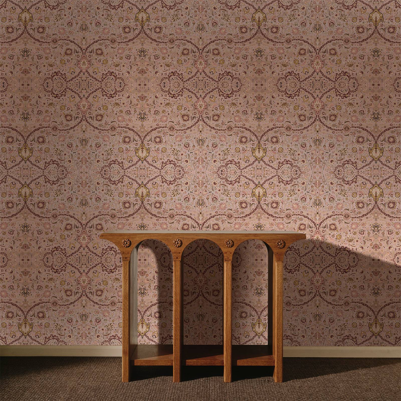 a wooden table in front of a wall