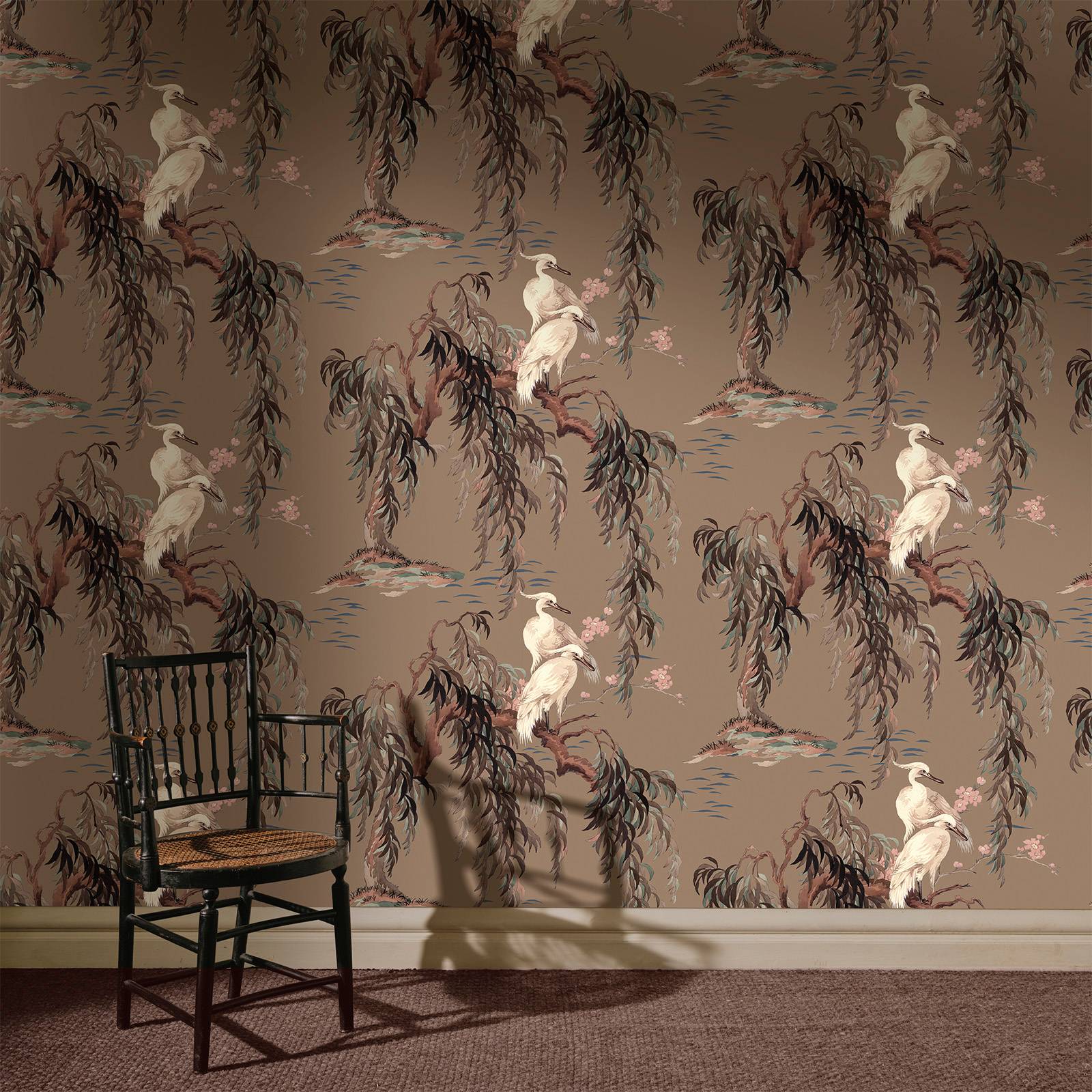 a chair in a room with a wallpaper