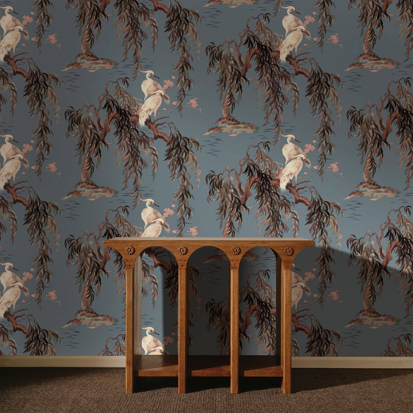 a wooden table in front of a wallpaper