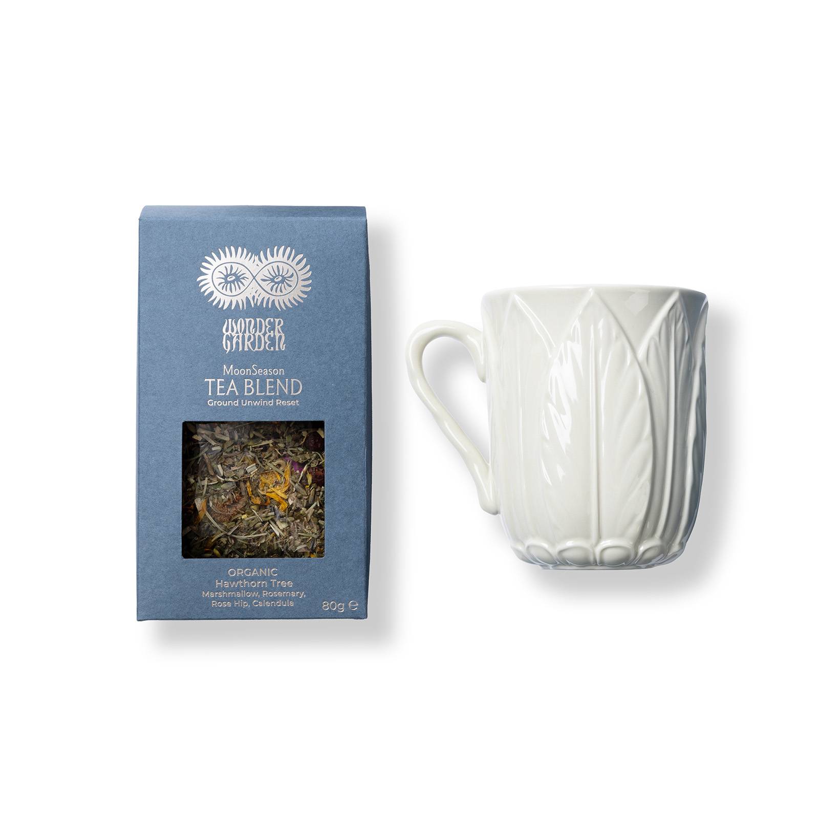 a white mug with a blue box and a blue container