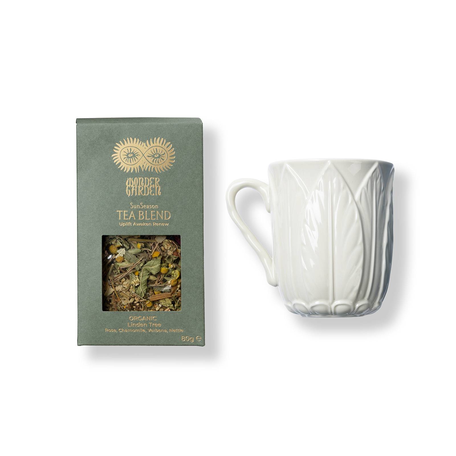 a white cup with a green box and a white mug with a green box and a white mug with a green label