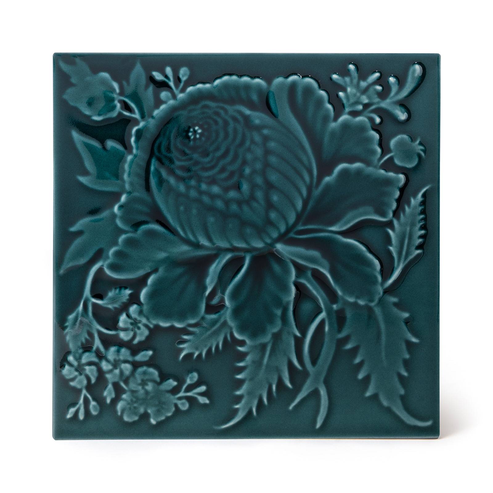 a blue tile with a flower design