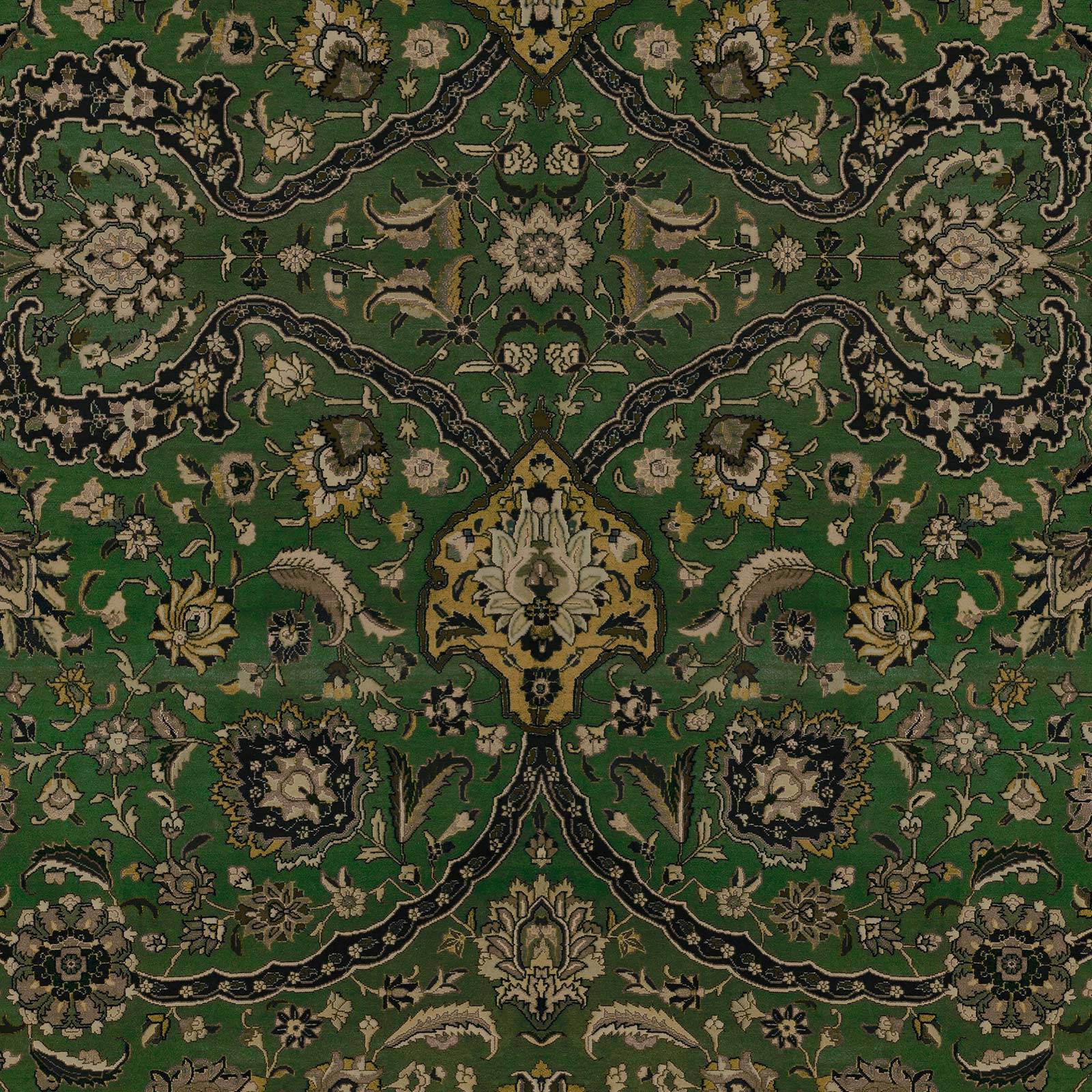 a green and black rug with floral design